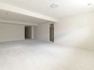 This spacious, unfinished basement offers a blank canvas for your dream home.