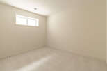 This empty room features a neutral color palette, making it a versatile space ready for your personal touch.