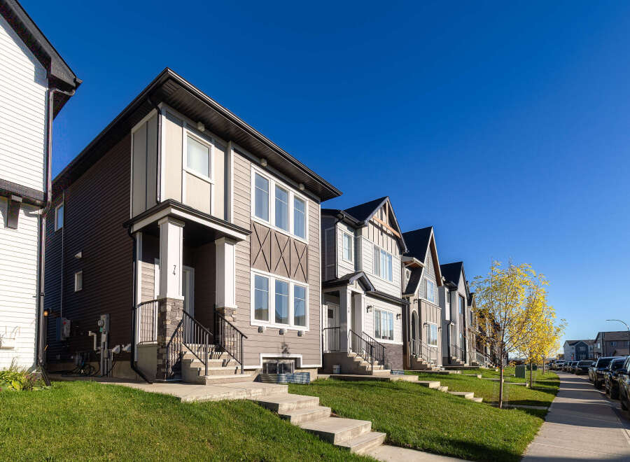 Discover modern living in this row of stylish townhouses, featuring a blend of contemporary siding and architectural accents.