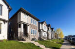 Discover modern living in this row of stylish townhouses, featuring a blend of contemporary siding and architectural accents.