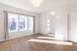 Step into this bright and airy living space, featuring a large bay window that floods the room with natural light.