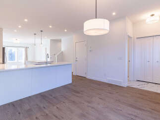 Step into this modern and spacious open-concept living area, perfect for entertaining.