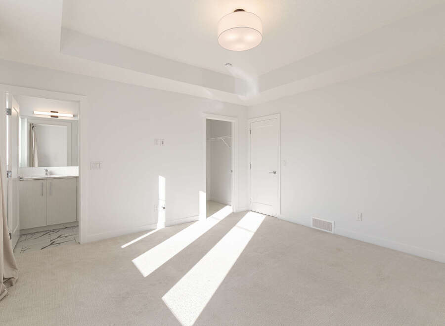 Step into this bright and airy bedroom, featuring a spacious layout and a convenient walk-in closet.