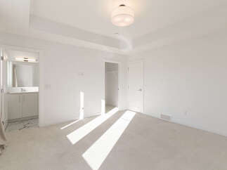 Step into this bright and airy bedroom, featuring a spacious layout and a convenient walk-in closet.