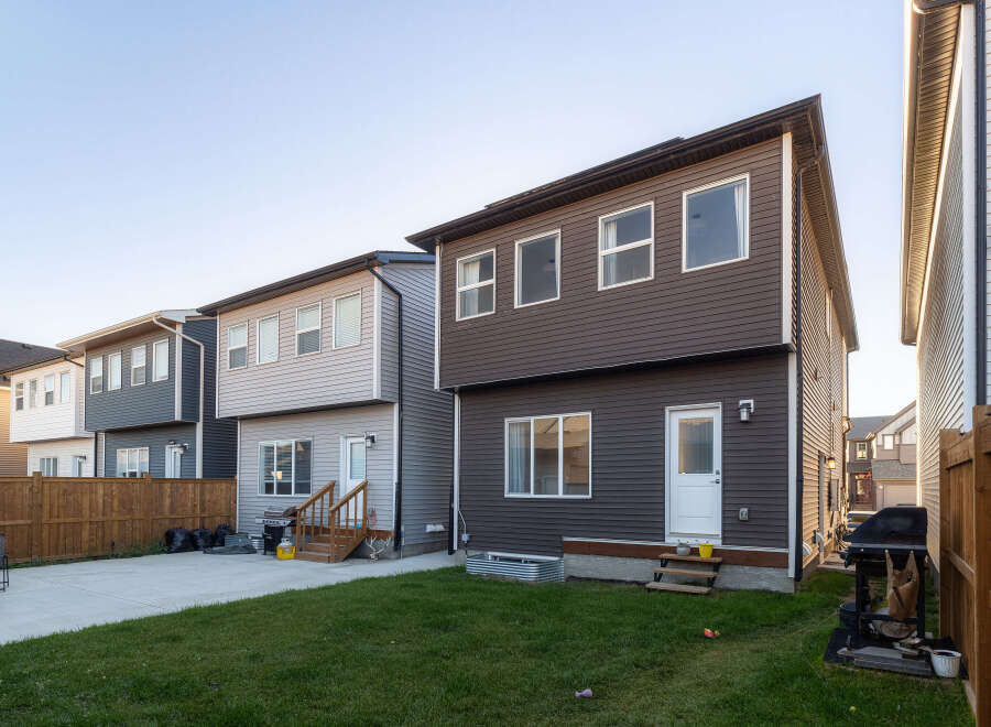 Discover modern living in this row of townhouses featuring sleek siding and ample windows for natural light.