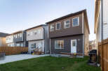 Discover modern living in this row of townhouses featuring sleek siding and ample windows for natural light.