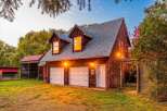 Discover this charming property featuring a spacious two-car garage with ample overhead storage, perfect for vehicles and hobbies.
