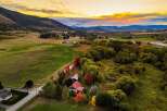 Experience the beauty of autumn in this stunning rural property, featuring a charming home nestled amongst vibrant fall foliage.
