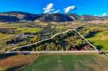 Discover this expansive property nestled amidst rolling hills and picturesque farmland.