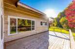 Enjoy the stunning natural beauty surrounding this log home, perfect for a peaceful retreat.