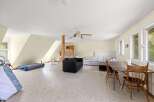 Discover a versatile living space with ample room for relaxation and entertainment.