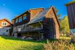 Discover rustic charm and ample space with this multi-story wooden structure, perfect for a workshop, storage, or conversion.
