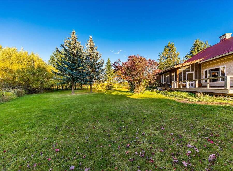 Experience the charm of this property with its expansive green lawn, perfect for outdoor activities and relaxation.