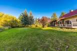 Experience the charm of this property with its expansive green lawn, perfect for outdoor activities and relaxation.