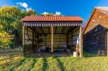 Discover this charming property featuring a spacious open-air barn with a durable metal roof, perfect for livestock or equipment storage.