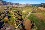 Discover this expansive parcel of land, nestled amidst rolling hills and picturesque farmland.