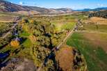 Discover this expansive parcel of land, nestled amidst rolling hills and picturesque farmland.