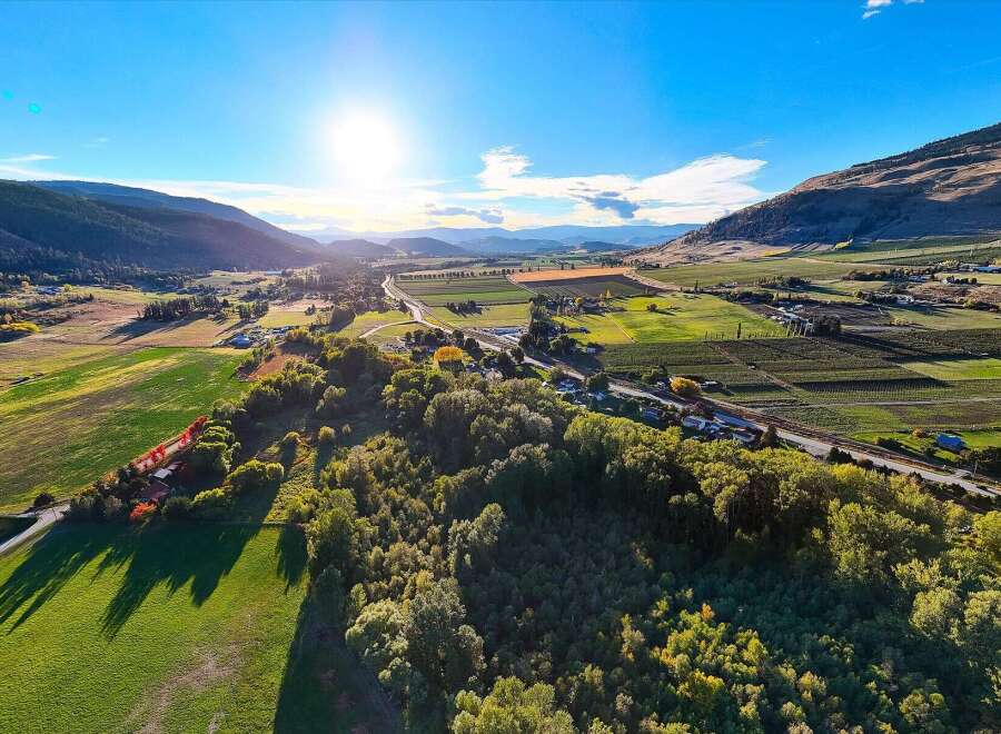 Experience breathtaking panoramic views of rolling hills and lush green fields from this stunning aerial perspective.