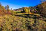 Nestled amidst the vibrant autumn foliage, this property offers a serene escape with its picturesque setting.