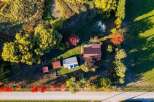 Experience the charm of rural living with this picturesque property, bathed in the warm glow of autumn sunlight.