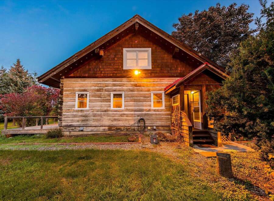 Experience rustic charm in this beautiful log cabin, nestled amongst mature trees and vibrant foliage.