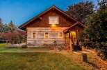 Experience rustic charm in this beautiful log cabin, nestled amongst mature trees and vibrant foliage.