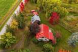 Experience the charm of autumn with this stunning aerial view of a rural property.
