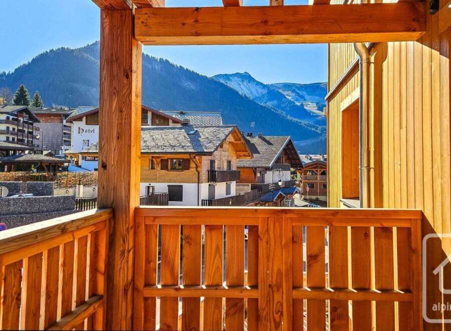 Experience breathtaking mountain views from this charming wooden balcony, perfect for enjoying your morning coffee or evening relaxation.