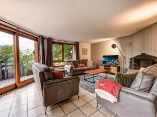 Experience cozy living in this inviting living room, featuring comfortable seating arrangements perfect for relaxation and entertainment.