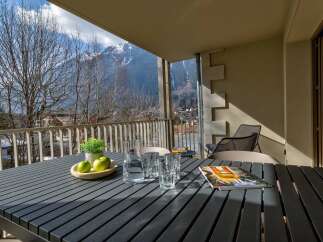 Enjoy breathtaking mountain views from this charming balcony, perfect for your morning coffee or evening relaxation.