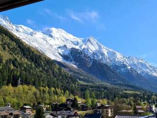 Experience breathtaking mountain views from this stunning property, nestled against a backdrop of snow-capped peaks and lush green forests.