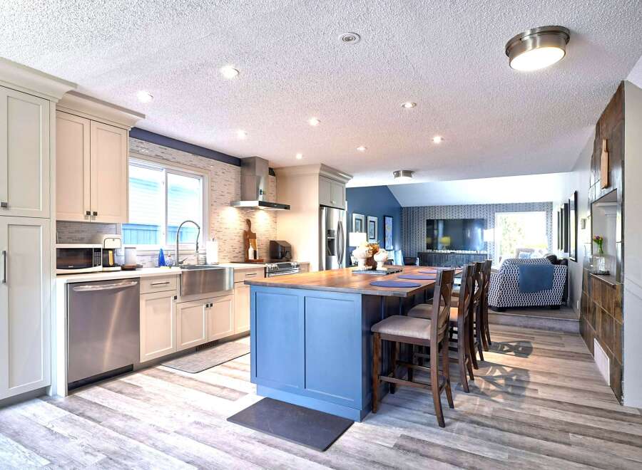 Experience the perfect blend of modern style and functionality in this stunning open-concept kitchen and living area.