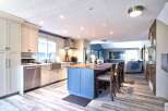 Experience the perfect blend of modern style and functionality in this stunning open-concept kitchen and living area.
