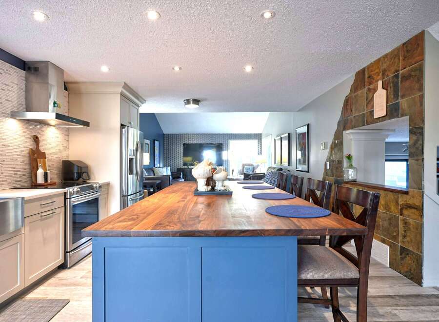 Experience modern living in this stunning kitchen and dining area.