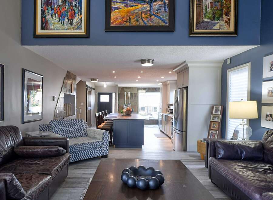 Experience the best of open-concept living in this beautifully appointed home, featuring a spacious living area that flows seamlessly into a modern kitchen and dining space.