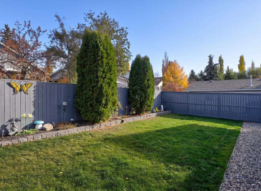 Step into this charming backyard, perfect for relaxation and entertaining.