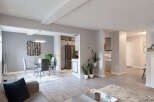 This spacious open-concept living area seamlessly blends the dining room and kitchen, perfect for entertaining.