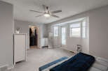 Step into this spacious master bedroom, featuring a large walk-in closet and a private balcony accessible through a glass door.