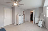 Step into this beautifully appointed bedroom featuring a modern ceiling fan and ample storage solutions.