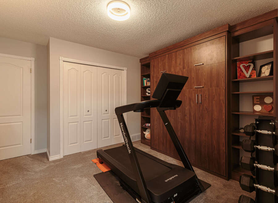 Transform your home into a personal fitness sanctuary with this dedicated workout space.