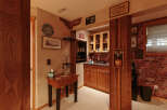 Step into this charming basement bar area, perfect for entertaining guests.