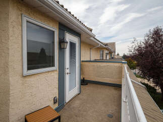 Enjoy outdoor living on this spacious balcony, perfect for relaxing or entertaining.