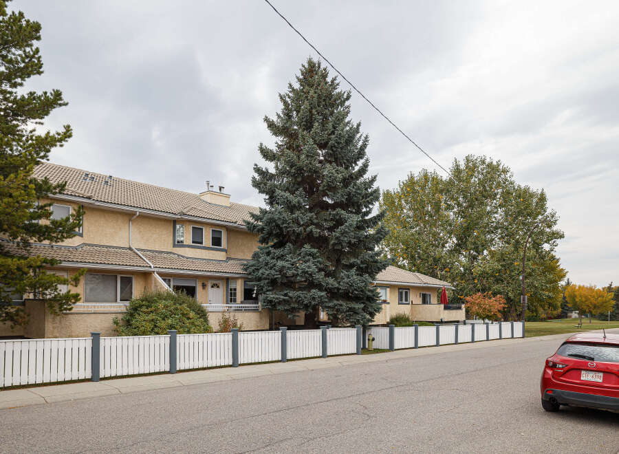 Discover this charming property featuring a stucco exterior and a tiled roof, offering a warm and inviting facade.