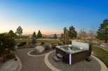 Experience luxurious outdoor living with this stunning backyard oasis, featuring a modern hot tub perfect for relaxation.