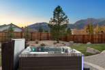 Experience ultimate relaxation in this backyard oasis, complete with a luxurious hot tub featuring vibrant LED lighting.