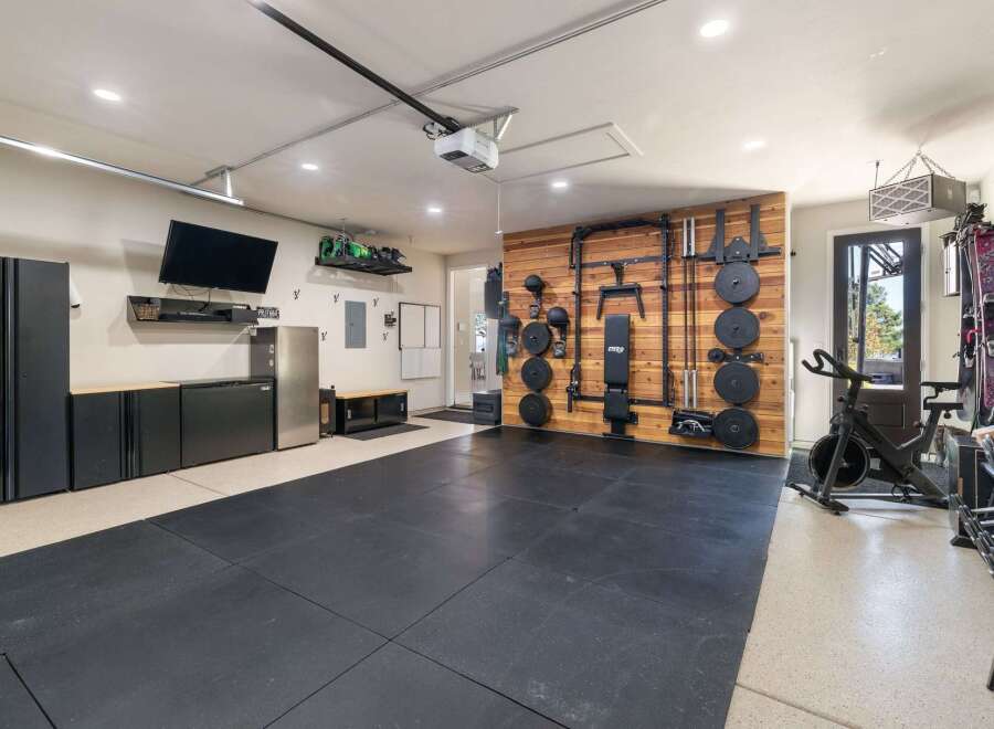 Transform your garage into a high-performance home gym with this fully equipped space.