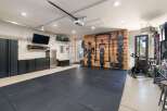 Transform your garage into a high-performance home gym with this fully equipped space.