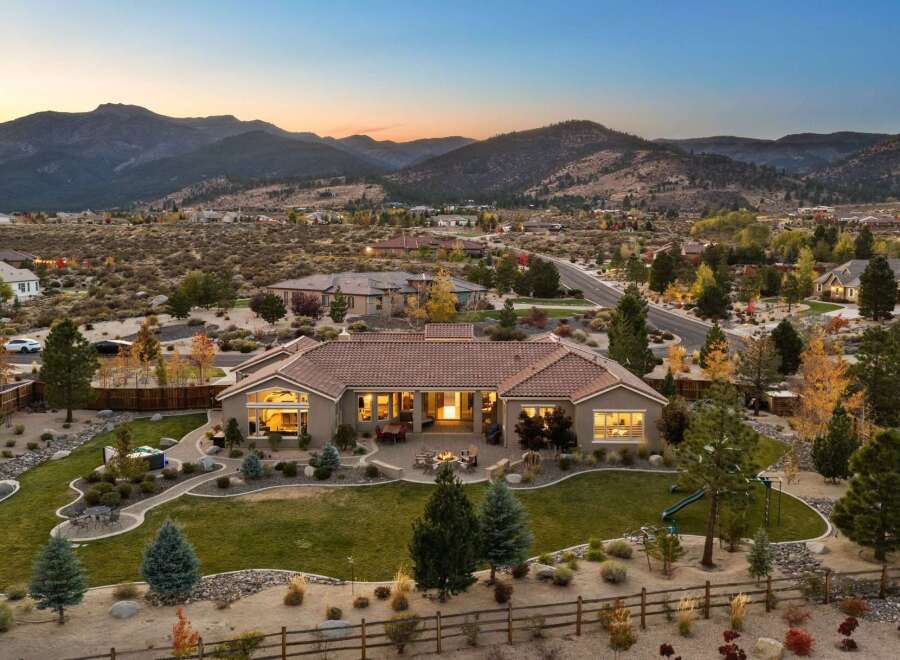 Experience luxury living in this stunning single-story home, nestled against a backdrop of majestic mountains.