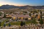 Experience luxury living in this stunning single-story home, nestled against a backdrop of majestic mountains.