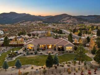 Experience luxury living in this stunning single-story home, nestled against a backdrop of majestic mountains.
